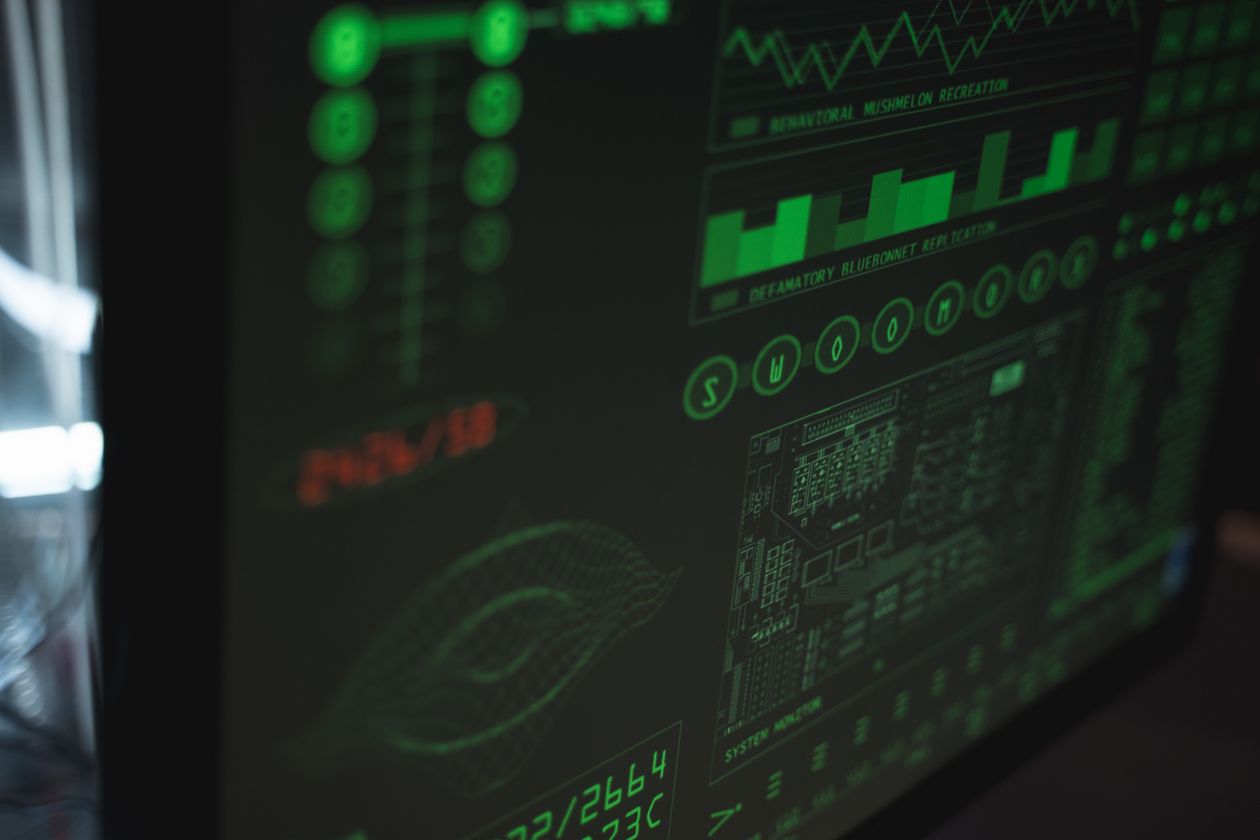Close-up view of a computer screen displaying cybersecurity and data protection interfaces in green tones