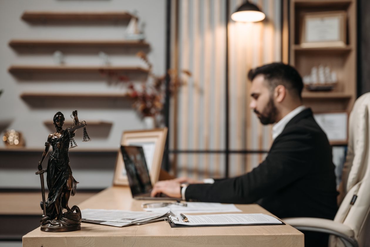 Lawyer using a laptop in a law office